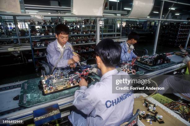 View of workers on an assembly line at the Changhong Electronics Group factory, Sichuan, China, September 16, 1997.