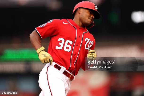 Stone Garrett of the Washington Nationals rounds the bases against the Arizona Diamondbacks after hitting a first inning grand slam at Nationals Park...