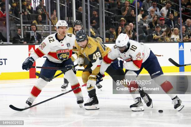 Gustav Forsling and Anthony Duclair of the Florida Panthers defend against Ivan Barbashev of the Vegas Golden Knights in Game Two of the 2023 NHL...