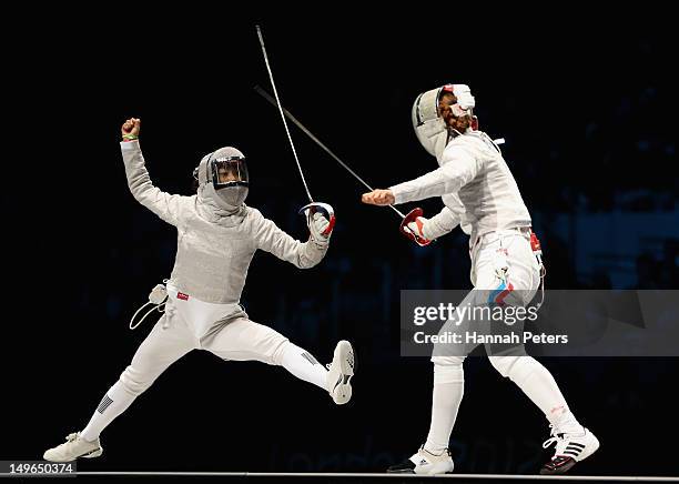 Jiyeon Kim of Korea competes in the Women's Sabre Individual Fencing Gold medal match against Sofya Velikaya of Russia on Day 5 of the London 2012...