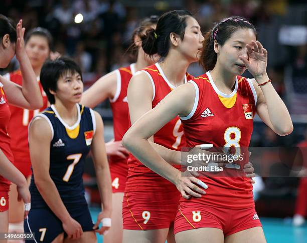 Qiuyue Wei, Junjing Yang and Xian Zhang of China react after losing to the United States during Women's Volleyball on Day 5 of the London 2012...