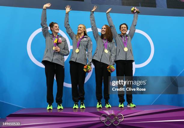 Missy Franklin, Dana Vollmer, Shannon Vreeland, and Allison Schmitt of the United States celebrate the medal ceremony for the Women's 4x200m...