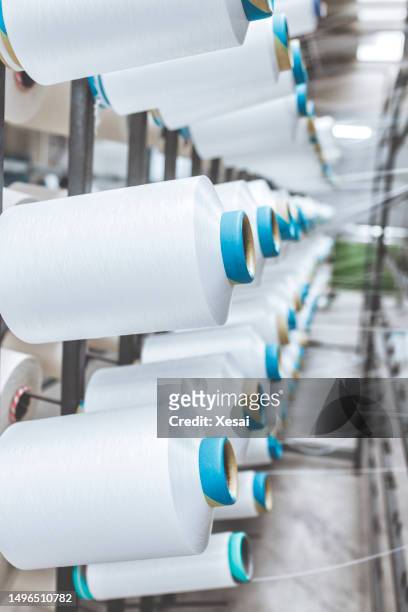 white yarn spools of industrial warping machine in textile factory - textile stock pictures, royalty-free photos & images
