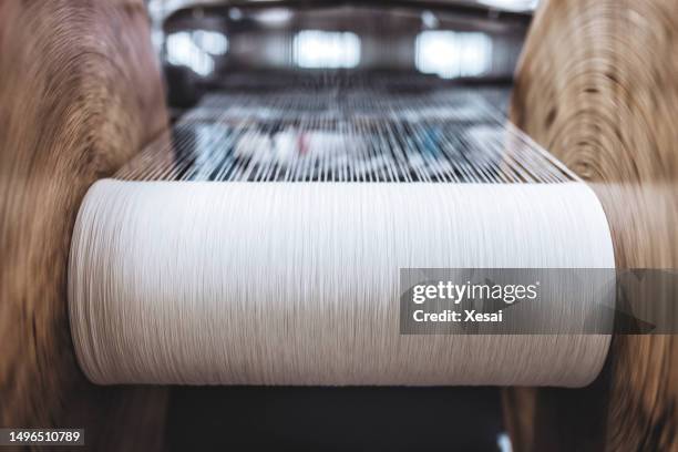 close up macro detail of yarn thread lines running in the weaving loom machine. yarn thread lines background. yarn thread lines texture. textured fabric background - silk garment stock pictures, royalty-free photos & images