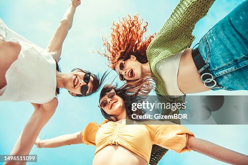 Three girlfriends having fun with hands up Three girlfriends having fun with hands up