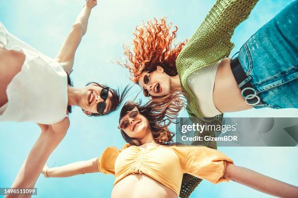 three girlfriends having fun with hands up - sunglasses stock pictures, royalty-free photos & images