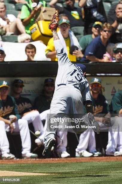 Ryan Roberts of the Tampa Bay Rays is unable to catch a foul ball hit off the bat of Eric Sogard of the Oakland Athletics during the fifth inning at...