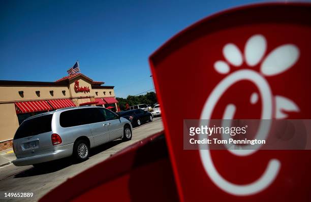 Drive through customers wait in line at a Chick-fil-A restaurant on August 1, 2012 in Fort Worth, Texas. Chick-fil-A resturants across the country...
