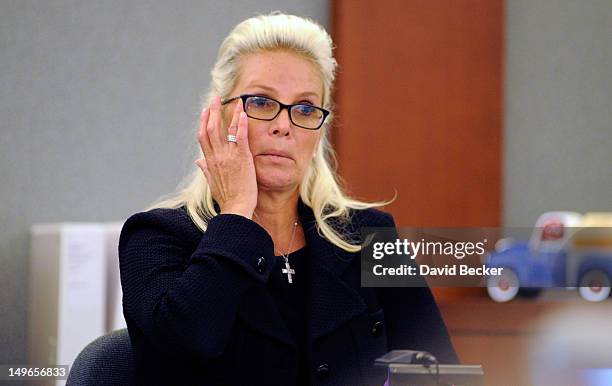 Kathleen McCrone Newton testifies on the witness stand during a court hearing at the Clark County Regional Justice Center on August 1, 2012 in Las...