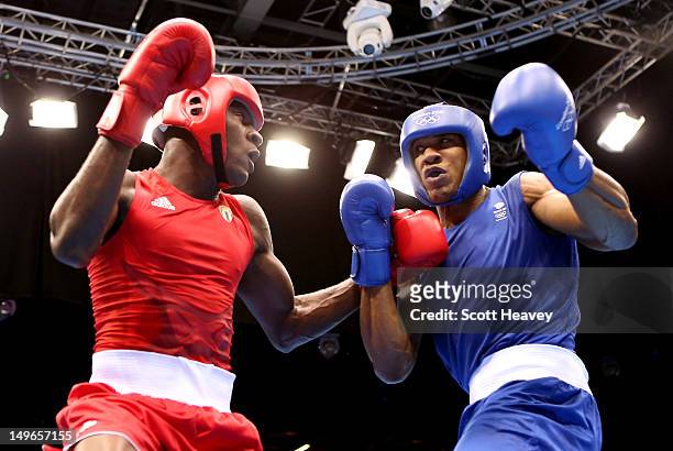 Anthony Joshua of Great Britain in action with Erislandy Savon Cotilla of Cuba during the Men's Super Heavy Boxing on Day 5 of the London 2012...