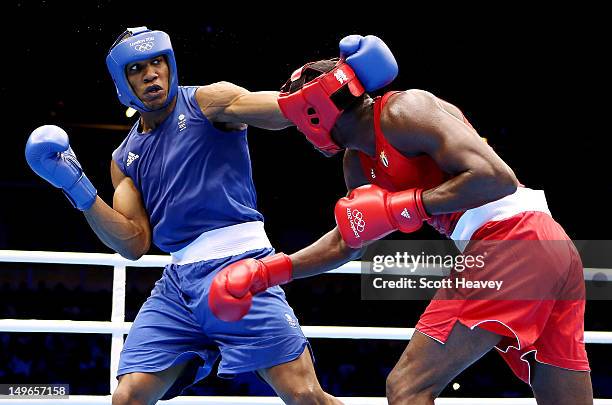 Anthony Joshua of Great Britain in action with Erislandy Savon Cotilla of Cuba during the Men's Super Heavy Boxing on Day 5 of the London 2012...