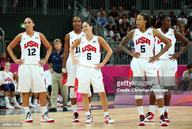 Diana Taurasi, Tamika Catchings, Sue Bird, Seimone Augustus and Tina Charles of the United States stand together on the court in the Women's...