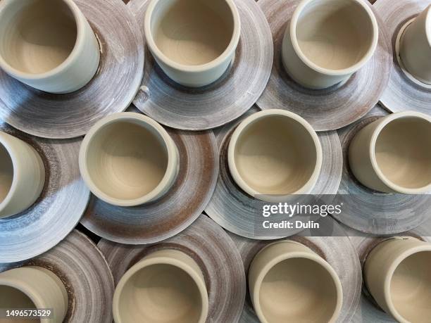 overhead view of ceramic cups ready to go in a pottery kiln - kiln stock pictures, royalty-free photos & images