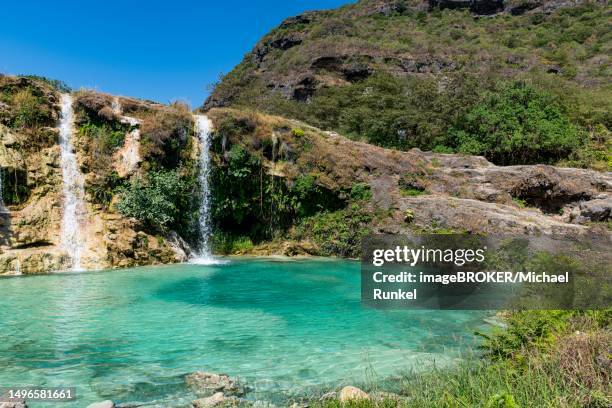 turquoise waterfalls, wadi darbat, salalah, oman - arabian peninsula stock pictures, royalty-free photos & images