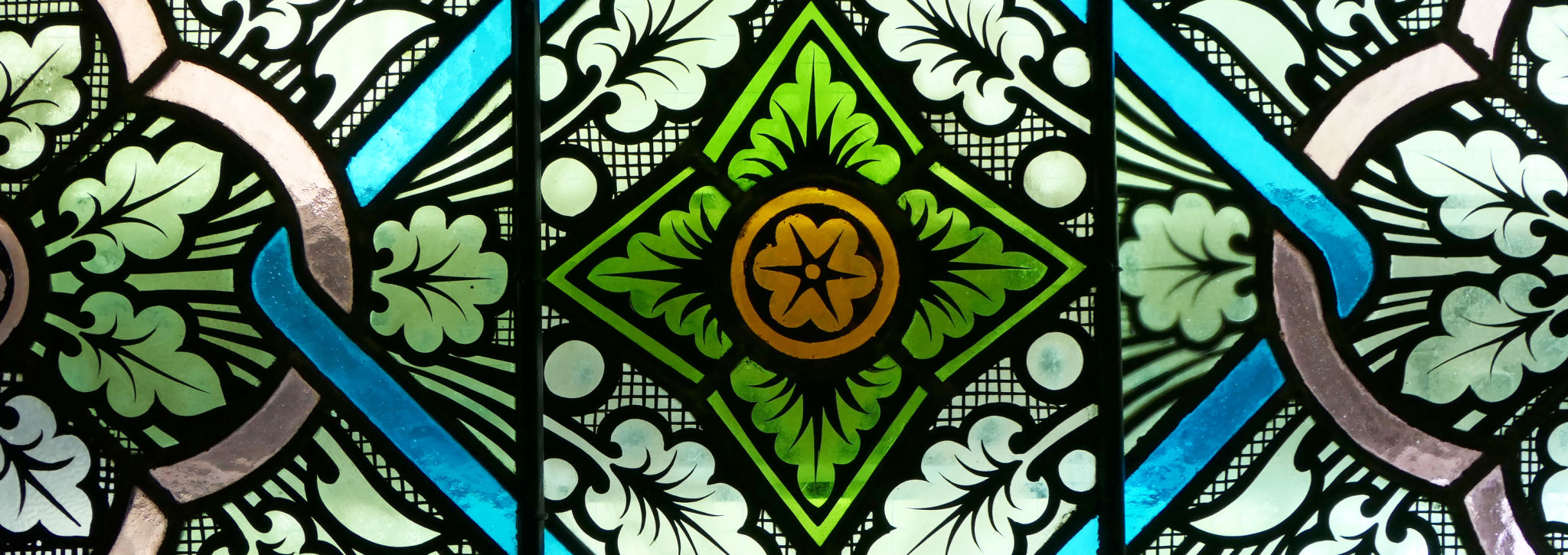 close-up stained glass window in a church close-up stained glass window in a church