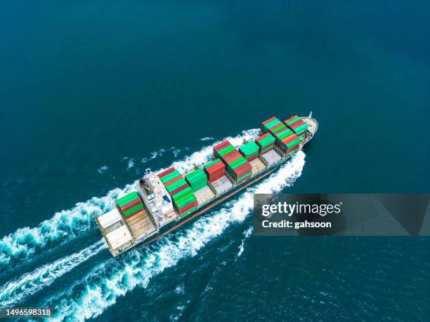 container cargo ship at sea - global business continuity stock pictures, royalty-free photos & images