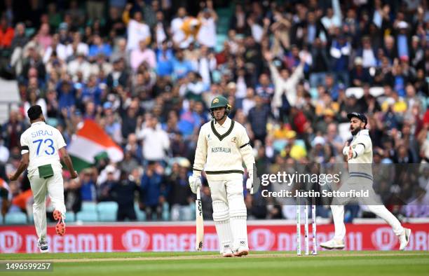 Usman Khawaja of Australia reacts after being dismissed by Mohammed Siraj of India during day one of the ICC World Test Championship Final between...