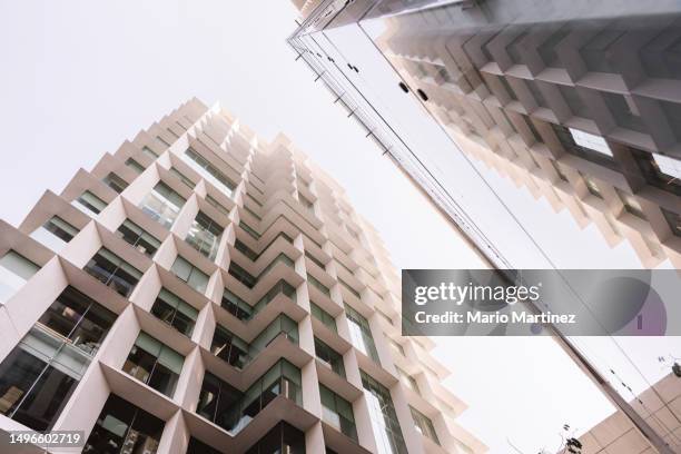 low angle view of modern office buildings - mexico city building stock pictures, royalty-free photos & images