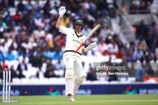 Marnus Labuschagne of Australia drops his bat after being hit on the hand during day one of the ICC World Test Championship Final between Australia...