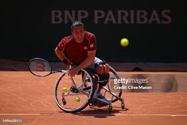 Gordon Reid of Great Britain serves against Alfie Hewett of Great Britain during the Men's Wheelchair Singles Quarter Final match on Day Eleven of...