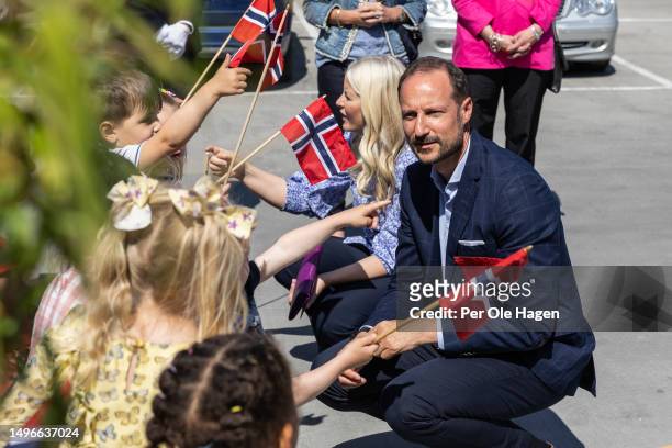 Crown Prince and Crown Princess with local children at Sisters In Business at Slemmestad on June 07, 2023 in Asker, Norway.