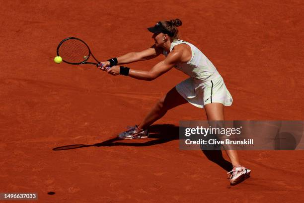 Beatriz Haddad Maia of Brazil plays a backhand against Ons Jabeur of Tunisia during the Women's Singles Quarter Final match on Day Eleven of the 2023...
