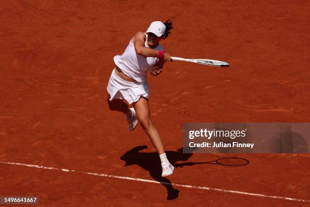 Iga Swiatek of Poland plays a forehand against Coco Gauff of United States during the Women's Singles Quarter Final match on Day Eleven of the 2023...