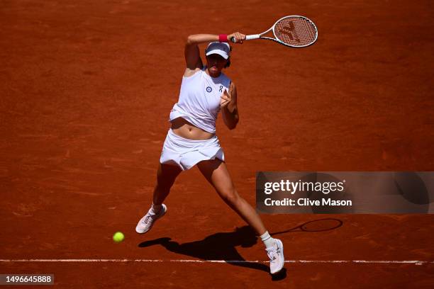 Iga Swiatek of Poland plays a forehand against Coco Gauff of United States during the Women's Singles Quarter Final match on Day Eleven of the 2023...