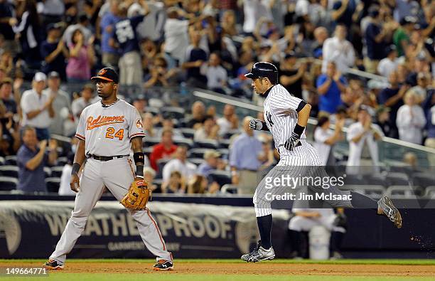Ichiro Suzuki of the New York Yankees runs the bases after his seventh inning home run past Wilson Betemit of the Baltimore Orioles at Yankee Stadium...
