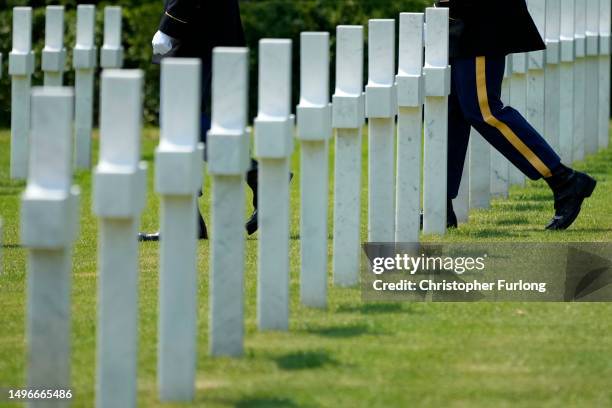 Military march among graves after a funeral ceremony of an unknown U.S WW1 soldier at Oise-Aisne Cemetery on June 7, 2023 in Seringes-et-Nesles,...