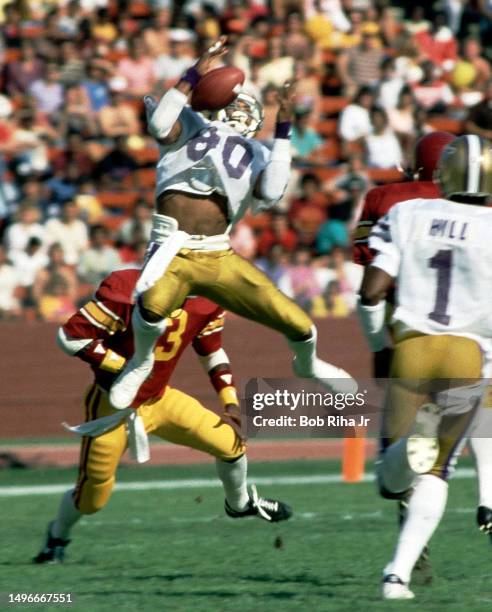 University of Washington Receiver Danny Greene heads up-field after catch during game against University of Southern California at Los Angeles...