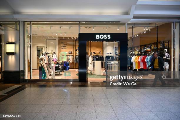 the hugo boss clothing store in the schadow arkaden in duesseldorf. - hugo boss store event in duesseldorf stock pictures, royalty-free photos & images