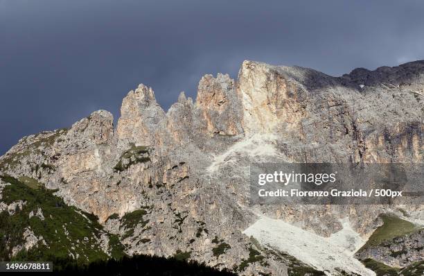 low angle view of rock formation against sky,soraga di fassa,italy - soraga stock pictures, royalty-free photos & images