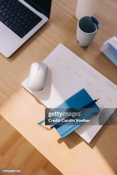 group of office items illuminated by a ray of sunlight - mouse pad stock pictures, royalty-free photos & images