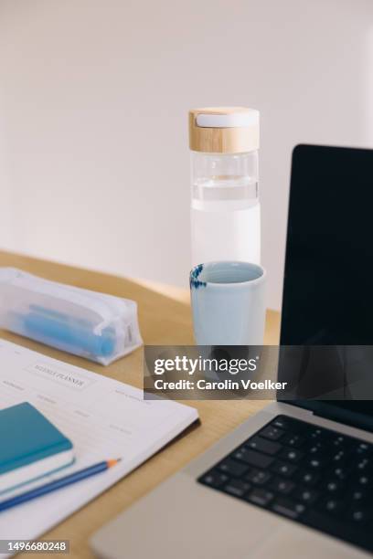 Computer Water Bottle Pencil In Cup Of Water Photos and Premium High Res Pictures - Getty Images