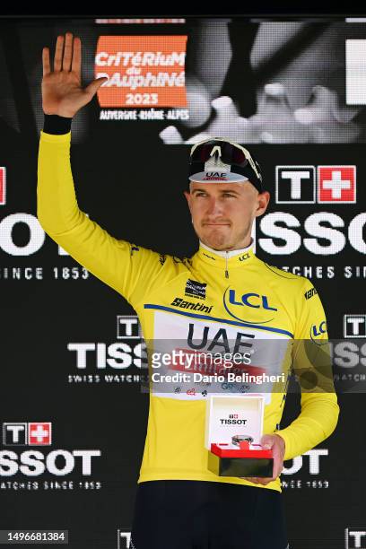 Mikkel Bjerg of Denmark and UAE Team Emirates celebrates at podium as Yellow leader jersey winner during the 75th Criterium du Dauphine 2023, Stage 4...
