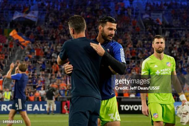 Evan Louro of FC Cincinnati is embraced by head coach Pat Noonan following a U.S. Open Cup quarterfinal soccer match against the Pittsburgh...
