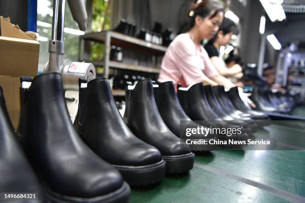 Employees make leather shoes for export at a factory on June 7, 2023 in Fuzhou, Fujian Province of China.