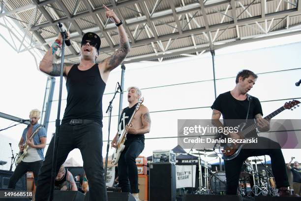 Lee Gaze, Ian Watkins, Stuart Richardson and Mike Lewis of Lostprophets perform on stage during Warped Tour at Marcus Amphitheatre on August 1, 2012...