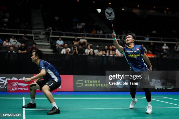 Mohammad Ahsan and Hendra Setiawan of Indonesia compete in the Men's Doubles First Round match against Lee Jhe-Huei and Yang Po-Hsuan of Chinese...