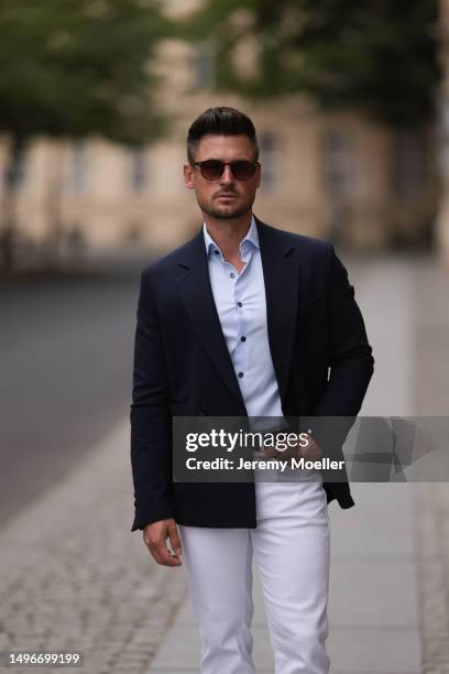 Andre Hellmundt wearing Massimo Dutti brown leather velvet loafer, Massimo Dutti black leather belt, white denim pants, Olymp light blue flanell and...