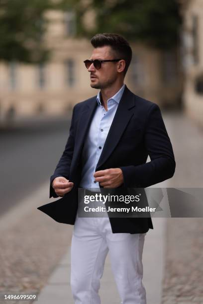 Andre Hellmundt wearing Massimo Dutti brown leather velvet loafer, Massimo Dutti black leather belt, white denim pants, Olymp light blue flanell and...