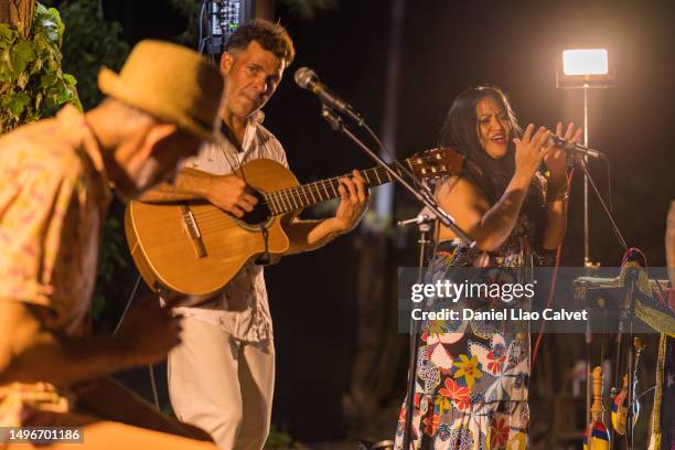 multi-ethnic music group performing on stage outdoors - text bands stock pictures, royalty-free photos & images