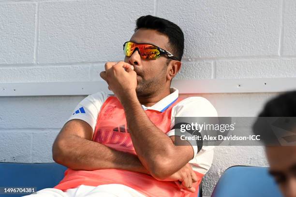 Ravichandran Ashwin of India sits in the dugout during day one of the ICC World Test Championship Final between Australia and India at The Oval on...