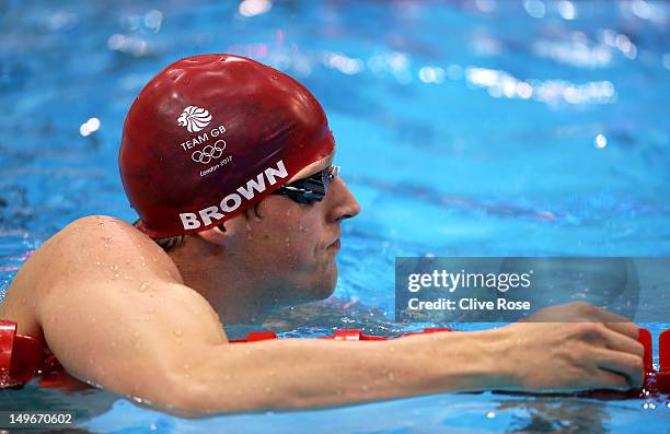 Adam Brown of Great Britain looks on after competing in the Men's 50m Freestyle heat 6 on Day 6 of the London 2012 Olympic Games at the Aquatics...