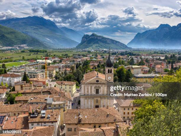 high angle view of townscape against sky,arco,trento,italy - trento stock-fotos und bilder