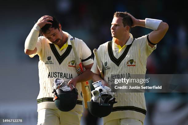 Travis Head and Steven Smith of Australia walk off the field following day one of the ICC World Test Championship Final between Australia and India...