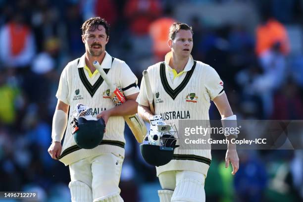 Travis Head and Steven Smith of Australia walk off the field following day one of the ICC World Test Championship Final between Australia and India...