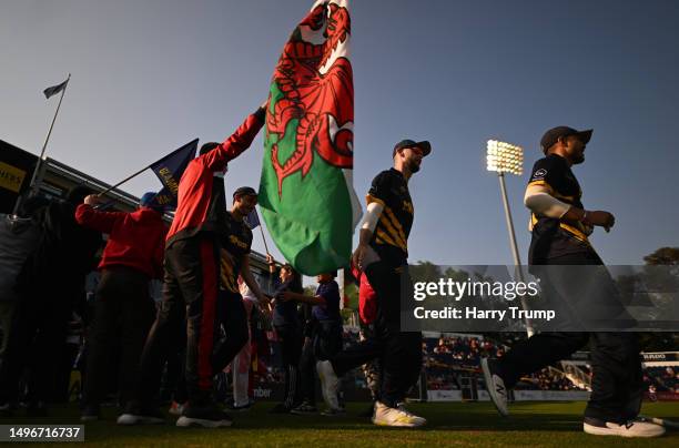 Players of Glamorgan make their way out to field during the Vitality T20 Blast match between Glamorgan and Surrey at Sophia Gardens on June 07, 2023...