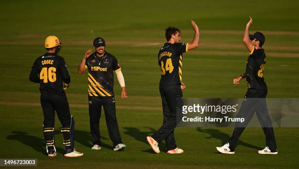 Peter Hatzoglou of Glamorgan celebrates the wicket of Will Jacks of Surrey during the Vitality T20 Blast match between Glamorgan and Surrey at Sophia...